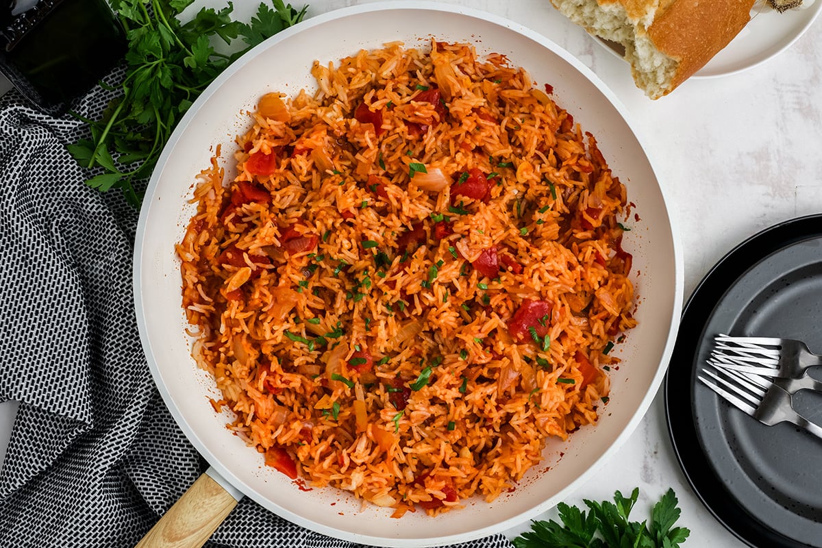 overhead shot of tomato rice in pan