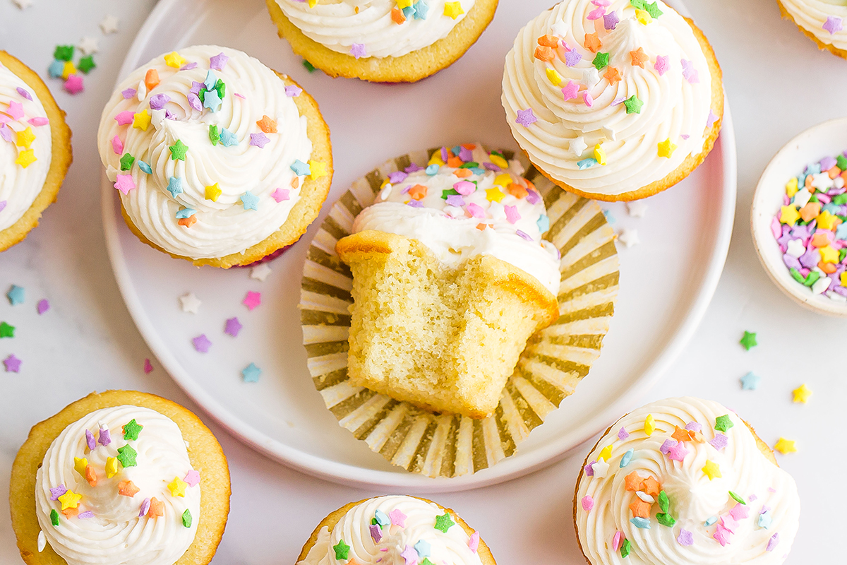 overhead view of cupcakes with frosting and rainbow star sprinkles