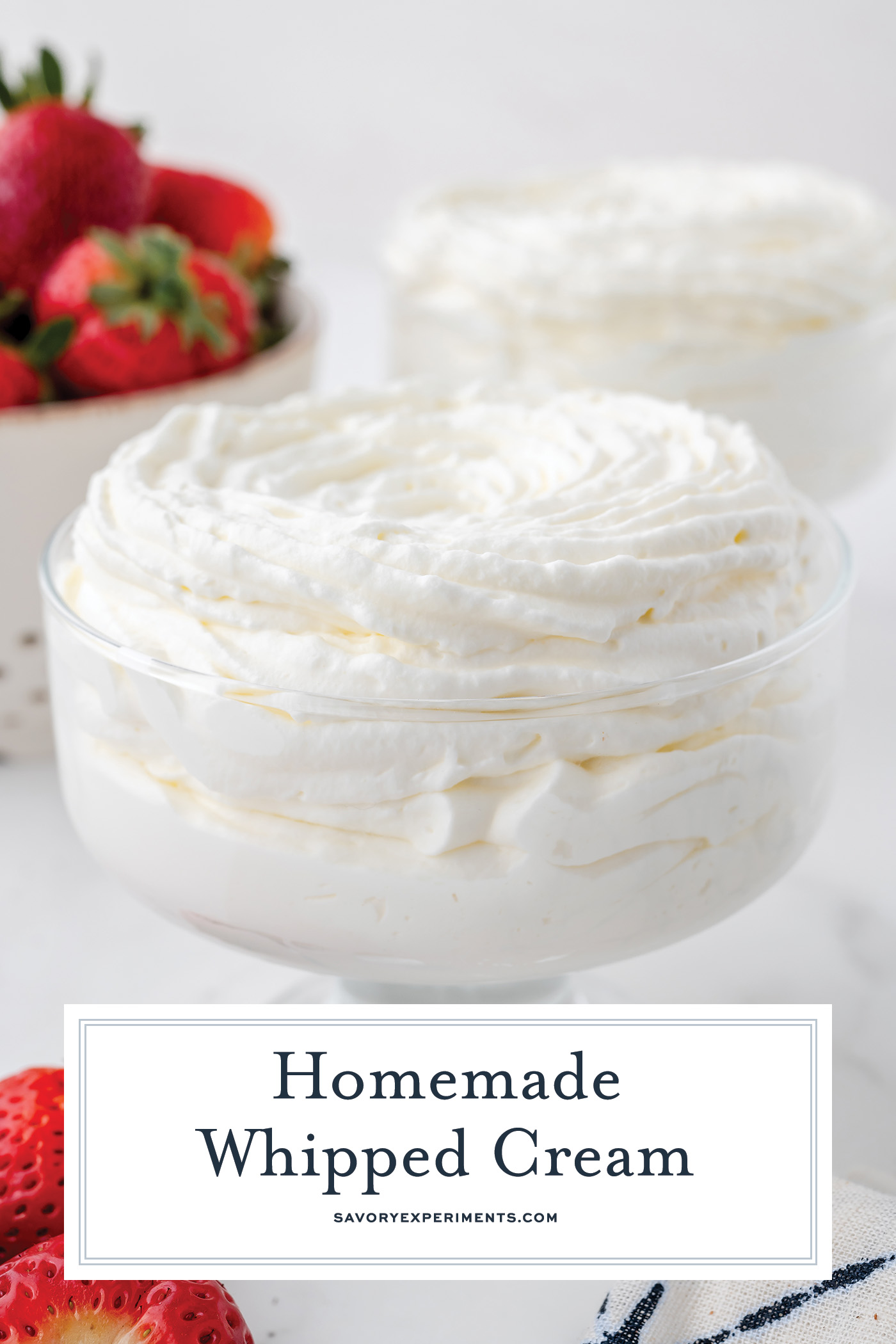 angled shot of bowl of homemade whipped cream with text overlay for pinterest