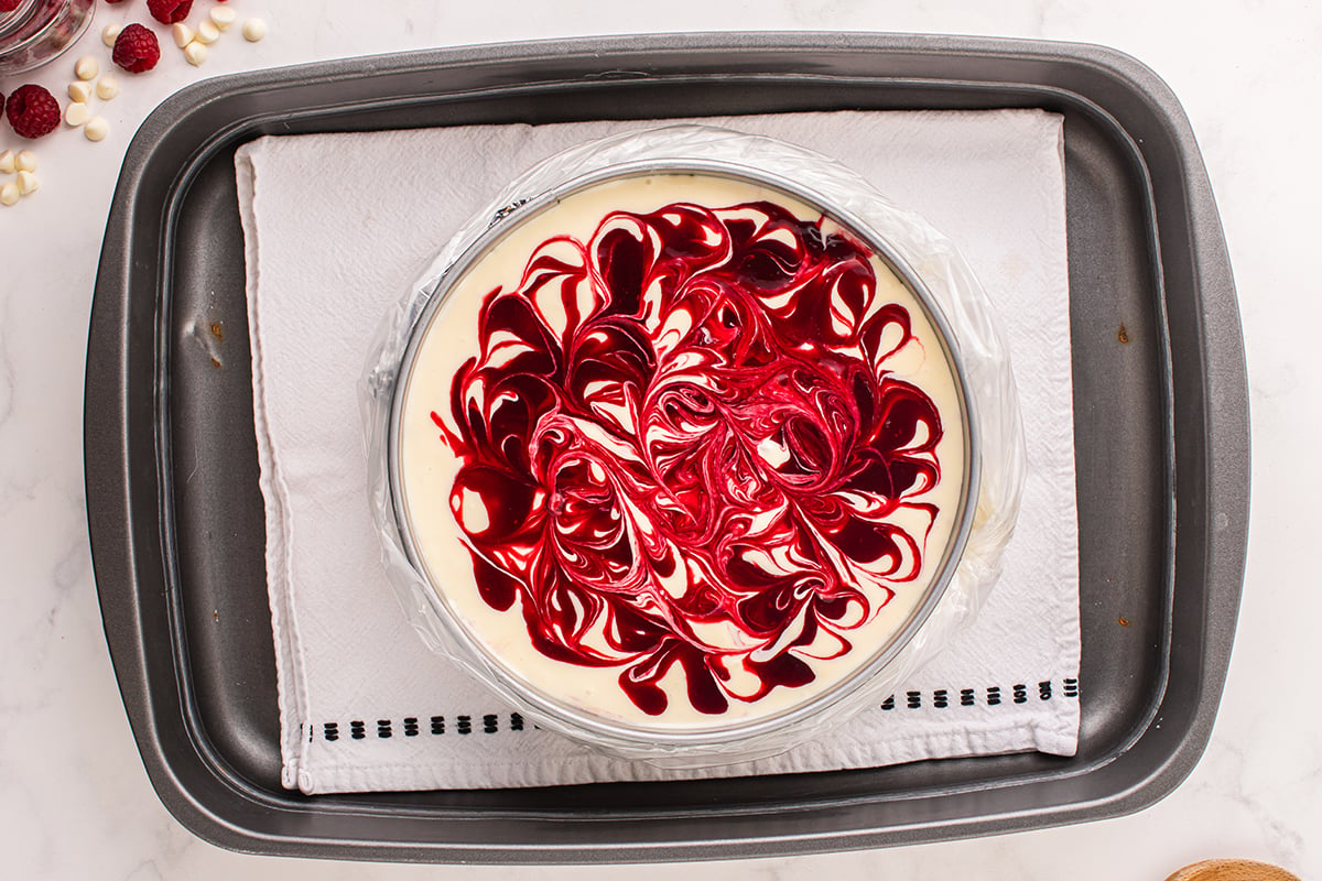 overhead shot of raspberry cheesecake in pan