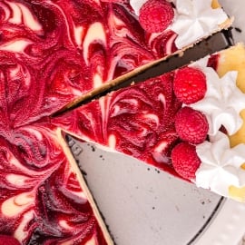 overhead shot of sliced raspberry cheesecake