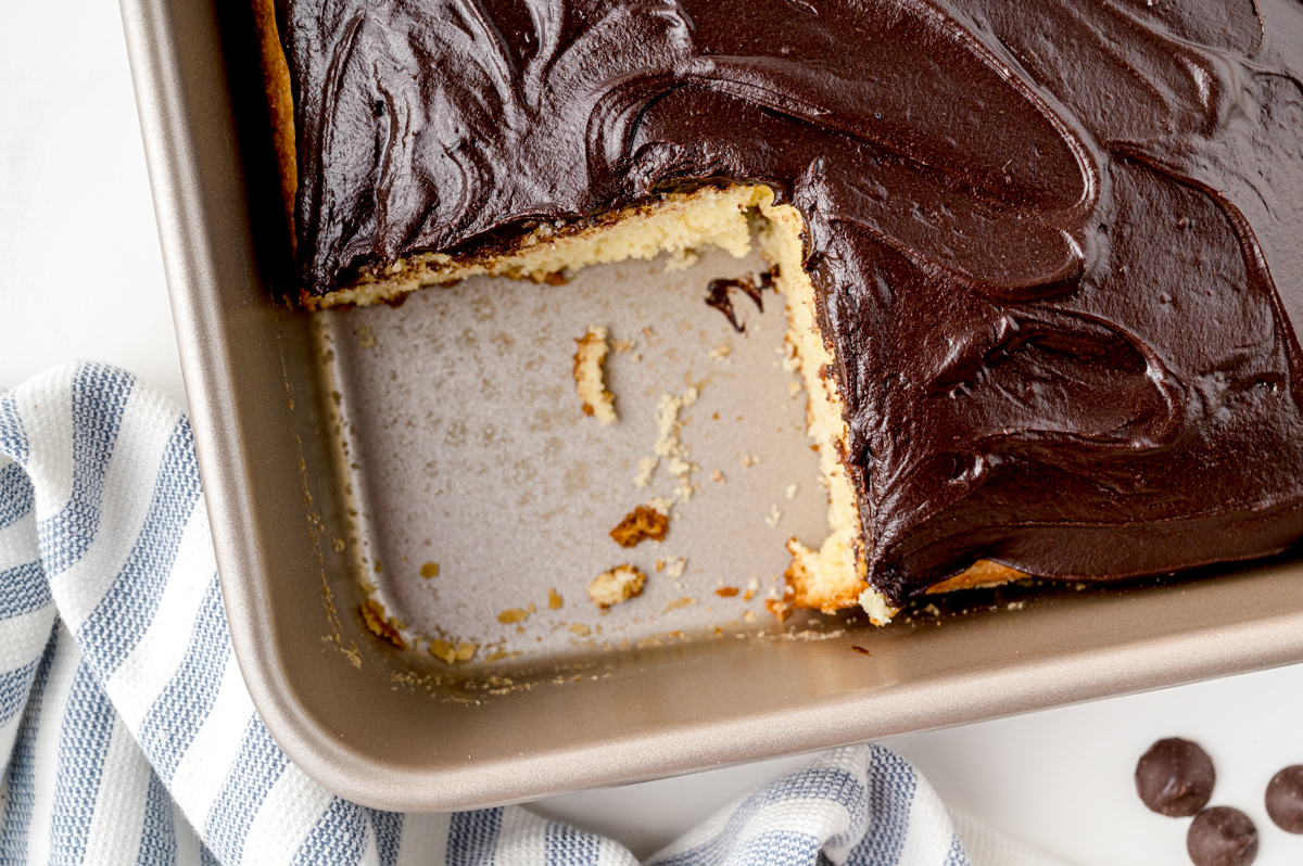 overhead square slice of sheet cake with chocolate frosting