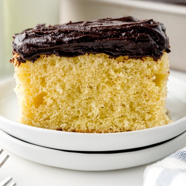 side view of slice of cake on a white serving plate