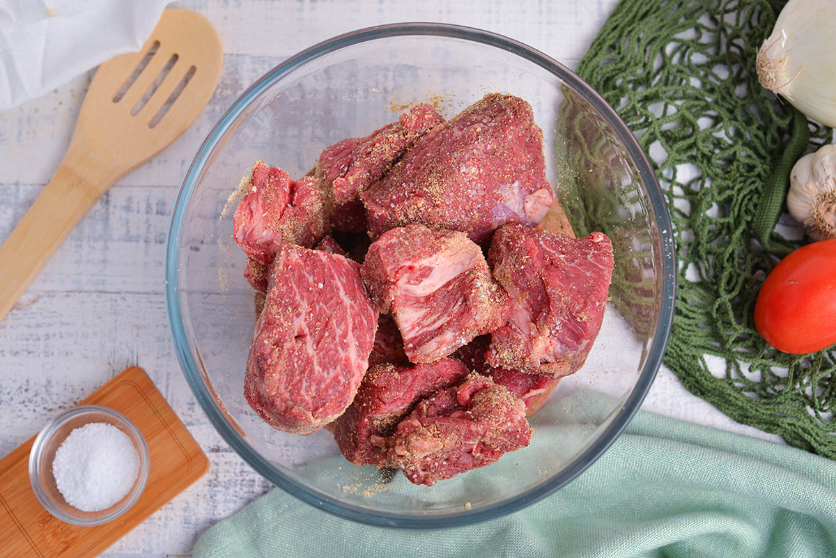 overhead shot of seasoned beef in bowl