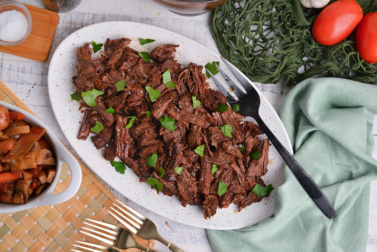 overhead shot of platter of shredded pot roast