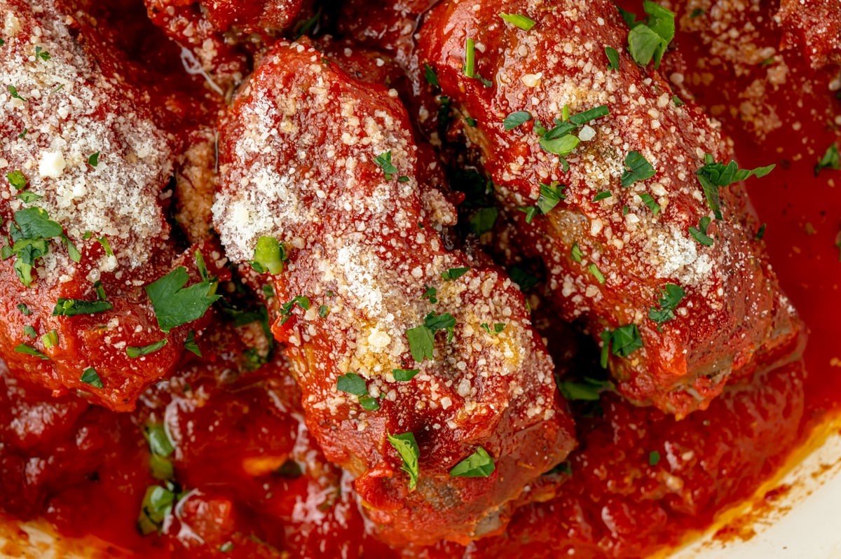 close up overhead shot of beef braciole in pan