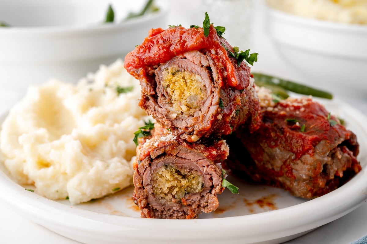 straight on shot of stacked sliced beef braciole