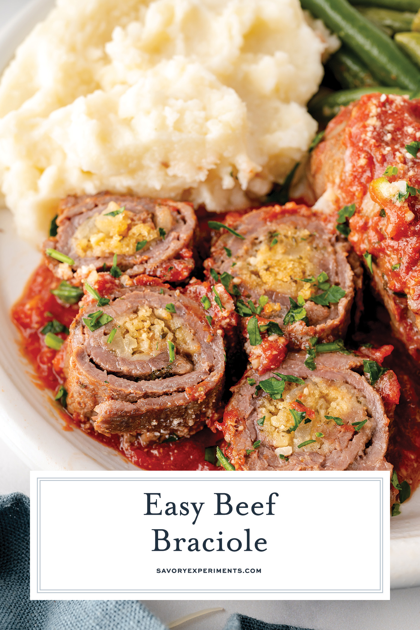 angled shot of sliced beef braciole with text overlay