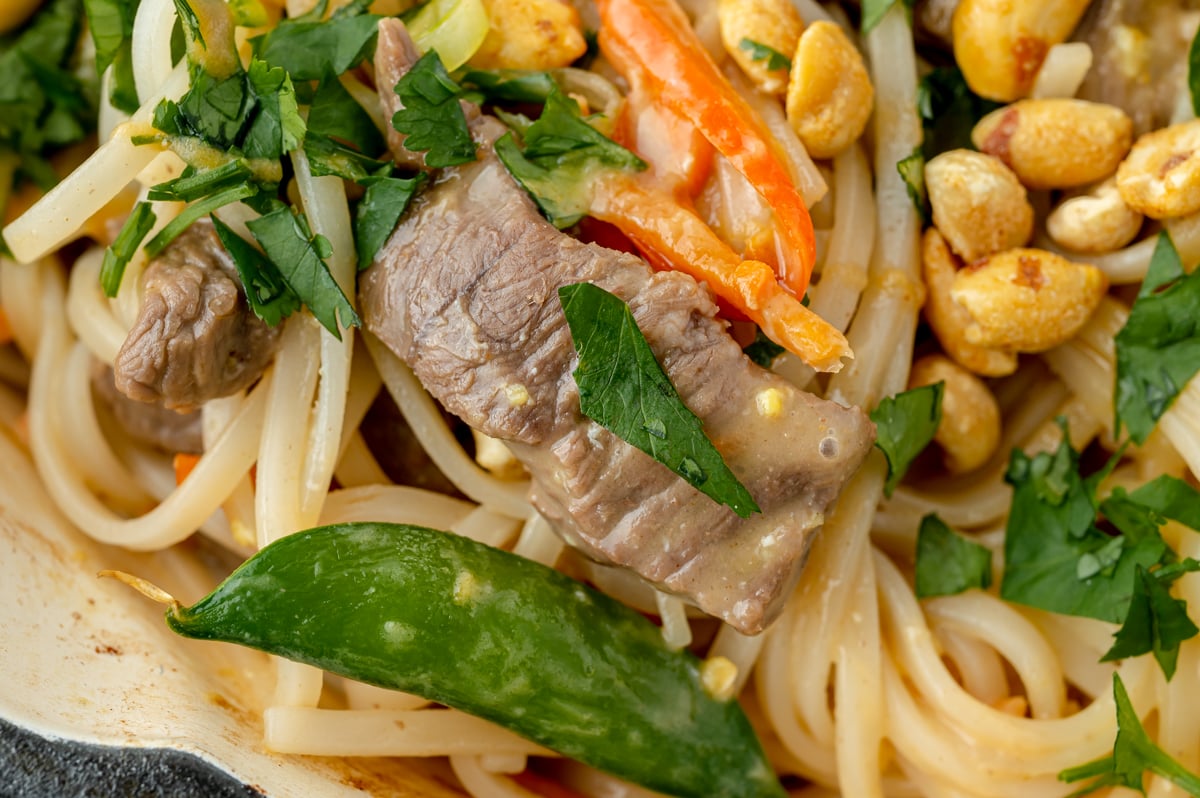 close up overhead shot of pan of beef pad thai