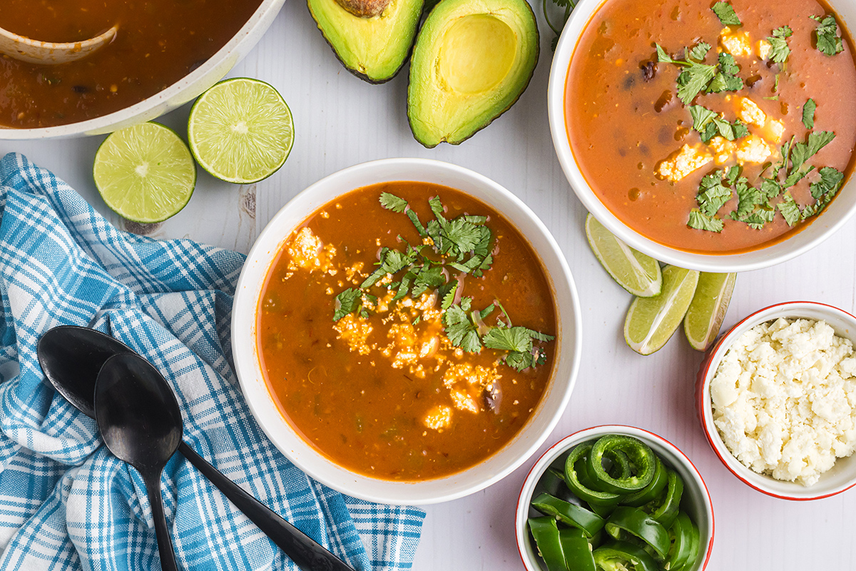 overhead shot of bowls of black bean soup