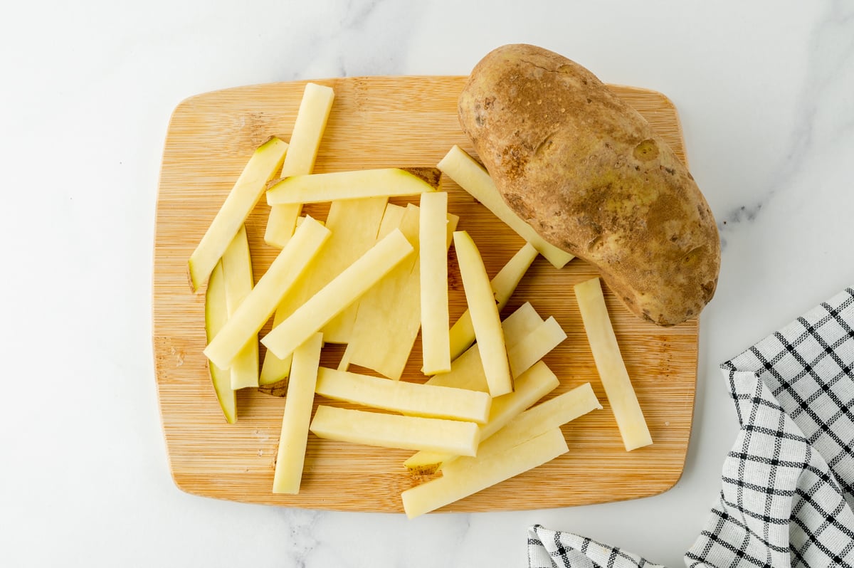 overhead shot of sliced potatoes on cutting board