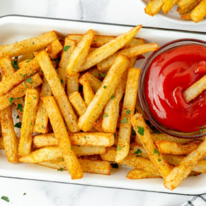 overhead shot of tray of Cajun fries with ketchup