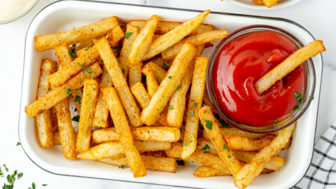 overhead shot of tray of Cajun fries with ketchup