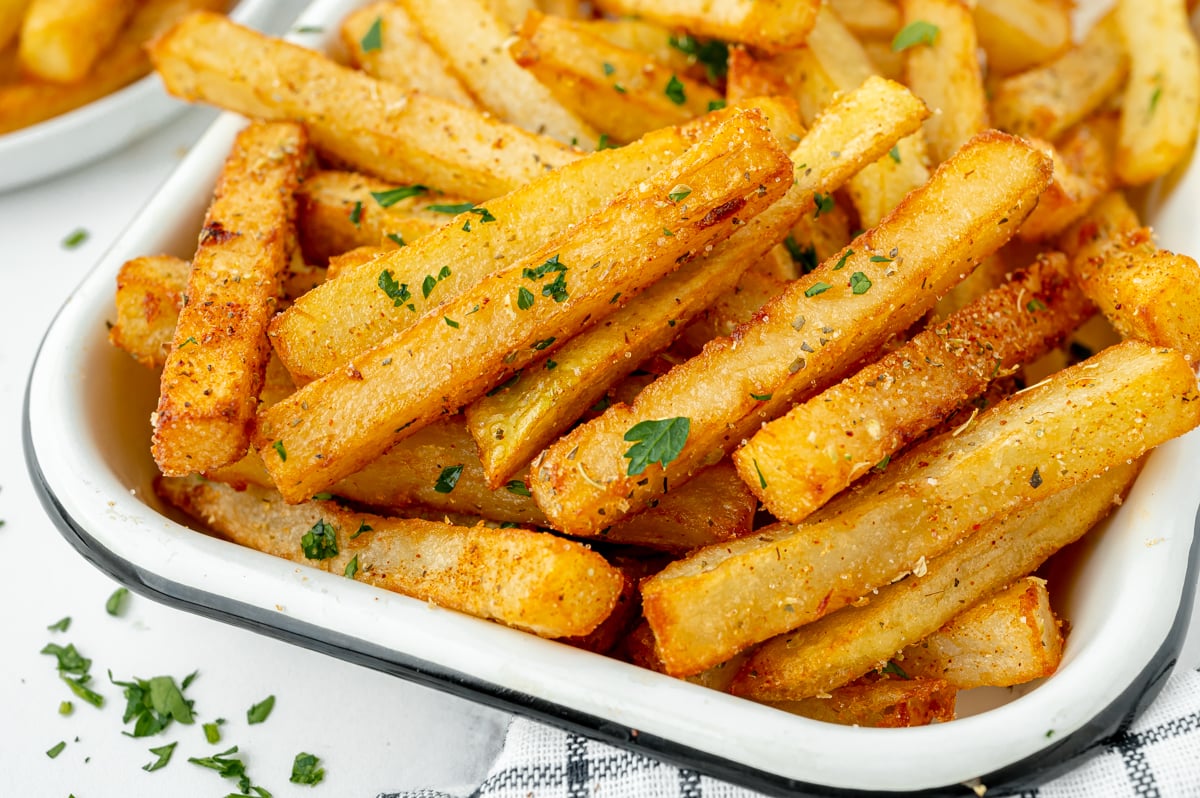 angled shot of cajun fries on plate