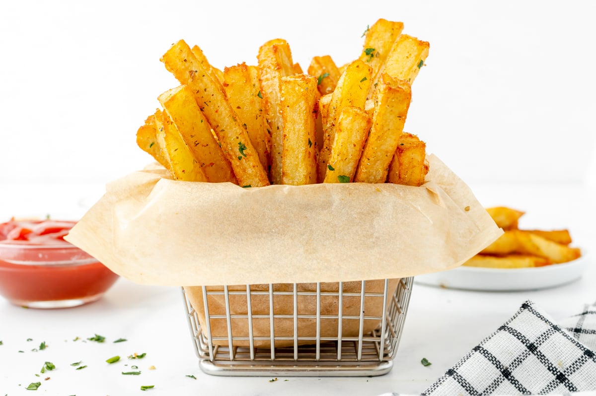 straight on shot of basket of cajun fries