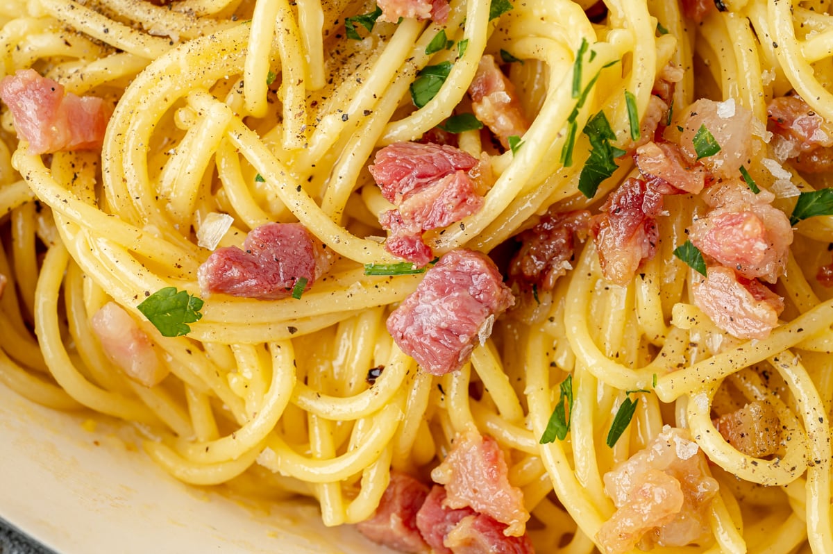 very close up shot of carbonara in pan