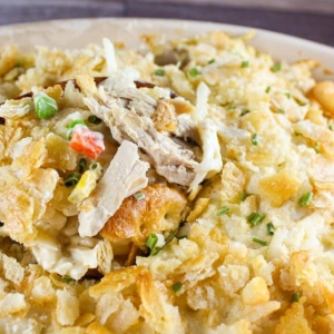 close up angled shot of spoon in chicken hashbrown casserole