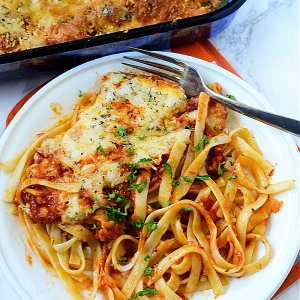 overhead shot of plate of chicken parmesan casserole