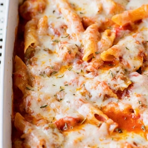 angled shot of chicken penne casserole in baking dish