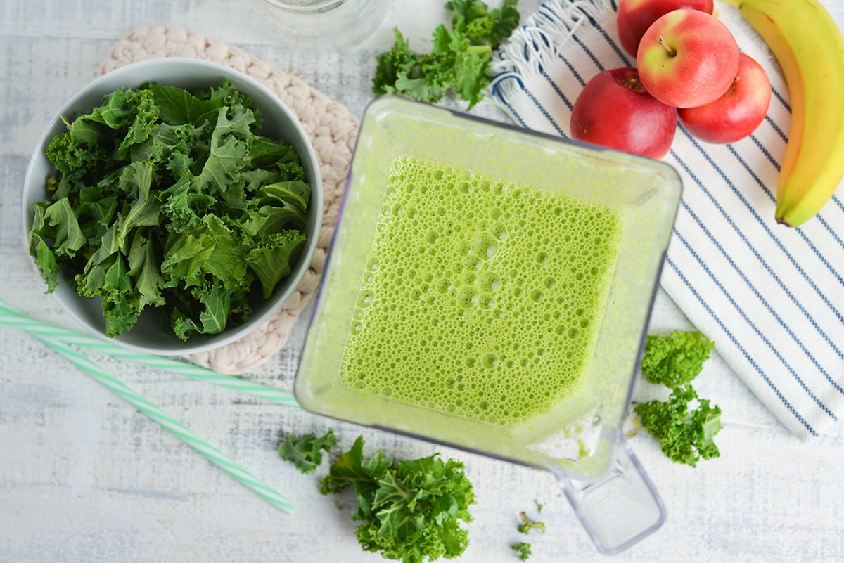 overhead shot of green smoothie in blender