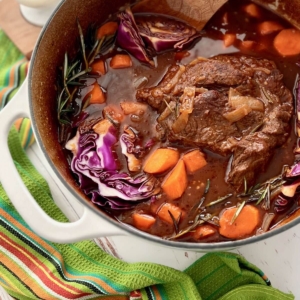 angled shot of guinness pot roast in pot