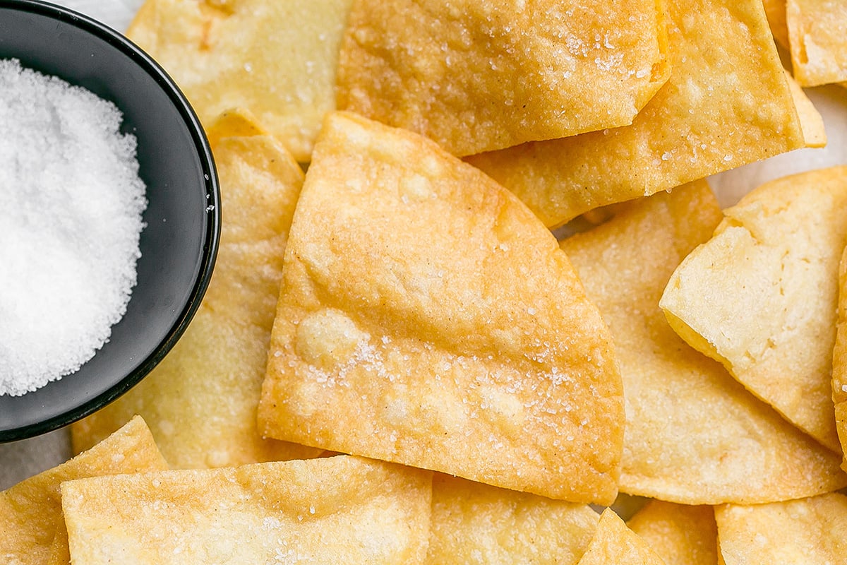 close up overhead shot of tortilla chip topped with sea salt