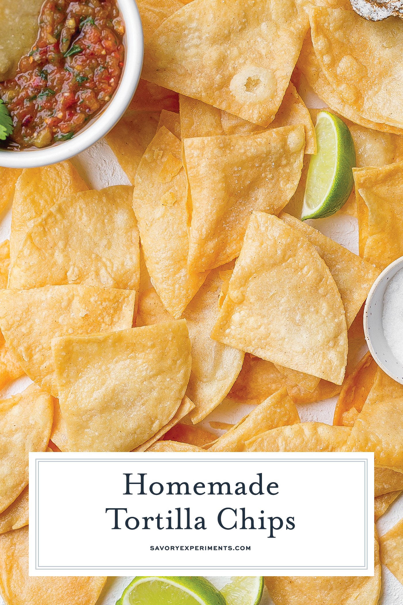 overhead shot of homemade tortilla chips with salsa and limes with text overlay