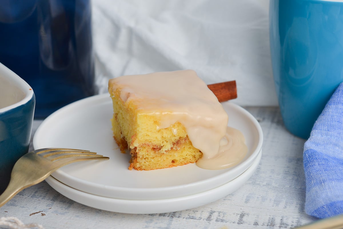 angled shot of slice of honey bun cake on plate