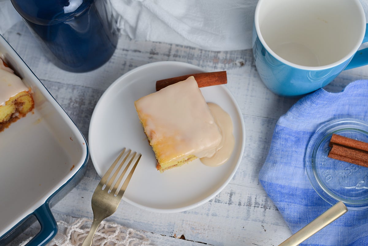 overhead shot of slice of honey bun cake on plate