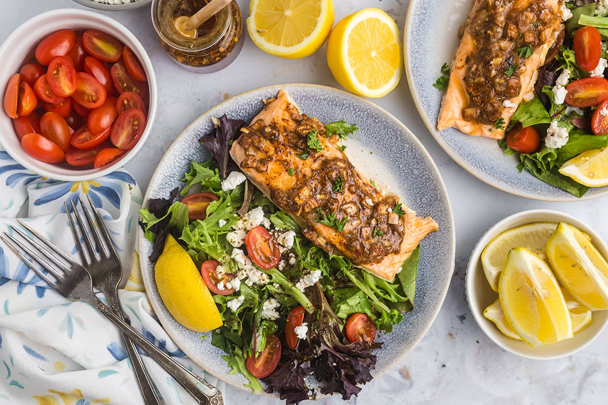 overhead shot of salad topped with hot honey salmon