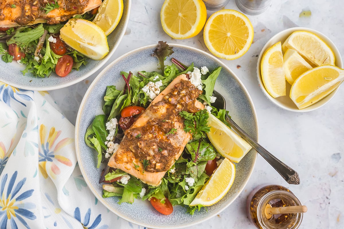 overhead shot of hot honey salmon on salad