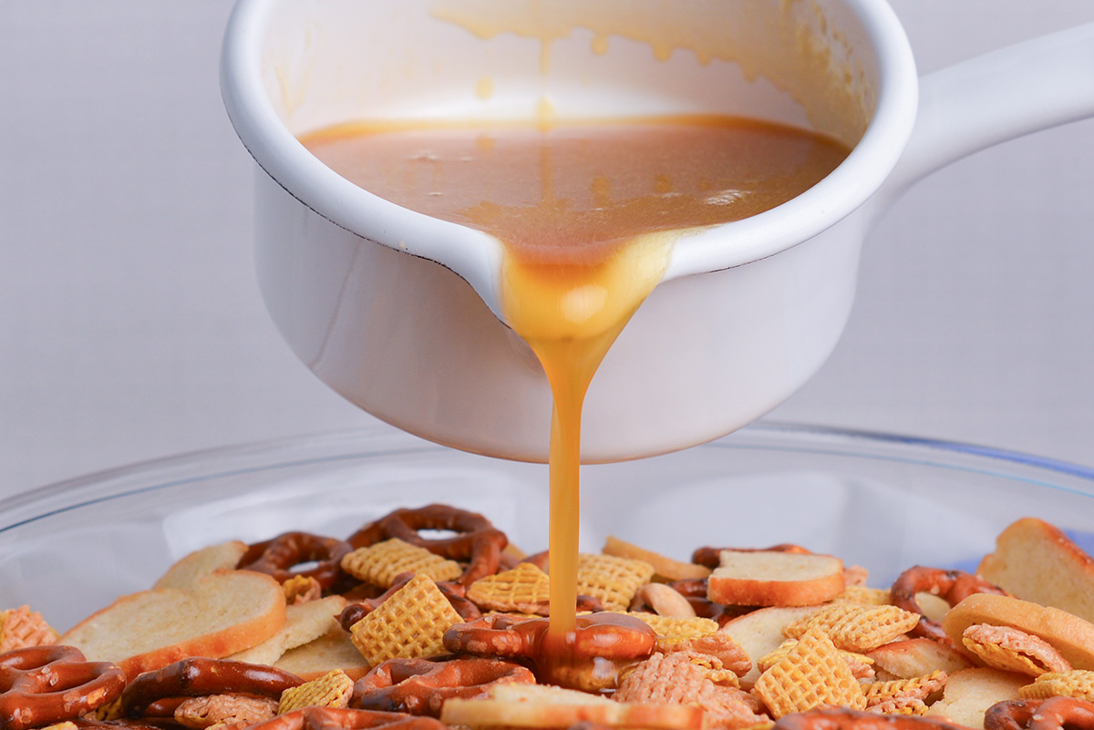 hot honey poured into chex mix