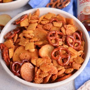 close up angled shot of bowl of hot honey snack mix