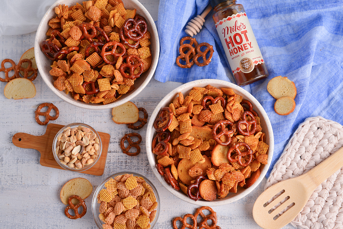 overhead shot of two bowls of hot honey snack mix