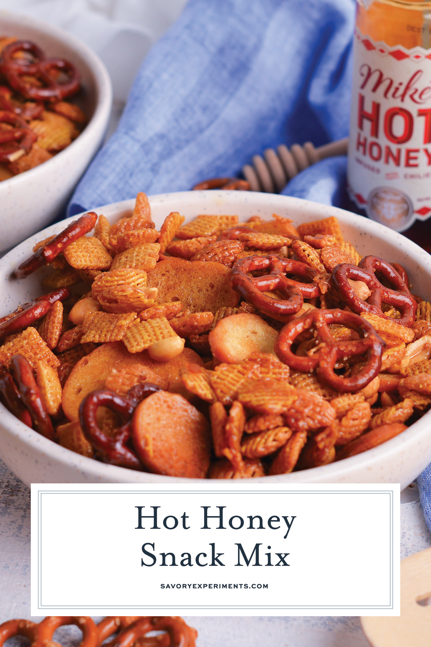 angled shot of bowl of hot honey snack mix with text overlay