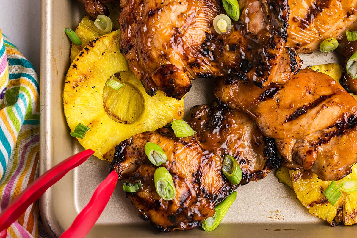 close up overhead shot huli huli chicken on sheet pan