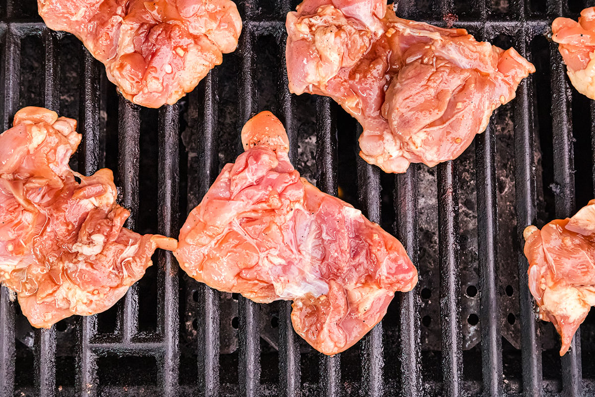 overhead shot of raw chicken on grill