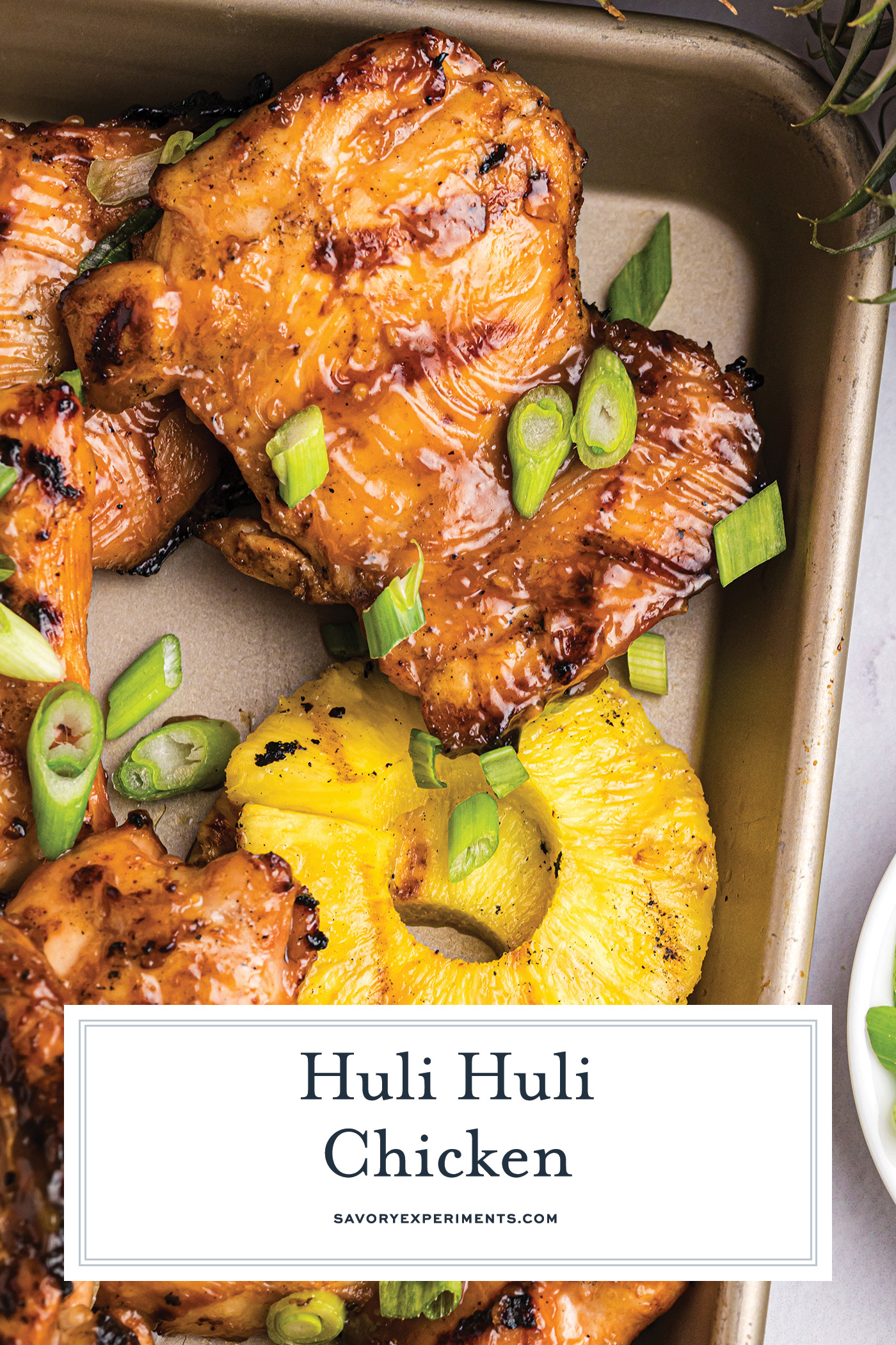 overhead shot of huli huli chicken on pan with text overlay
