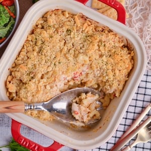 overhead shot of serving spoon in dish of huntington chicken casserole