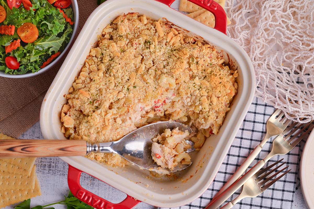 overhead shot of serving spoon in dish of huntington chicken casserole