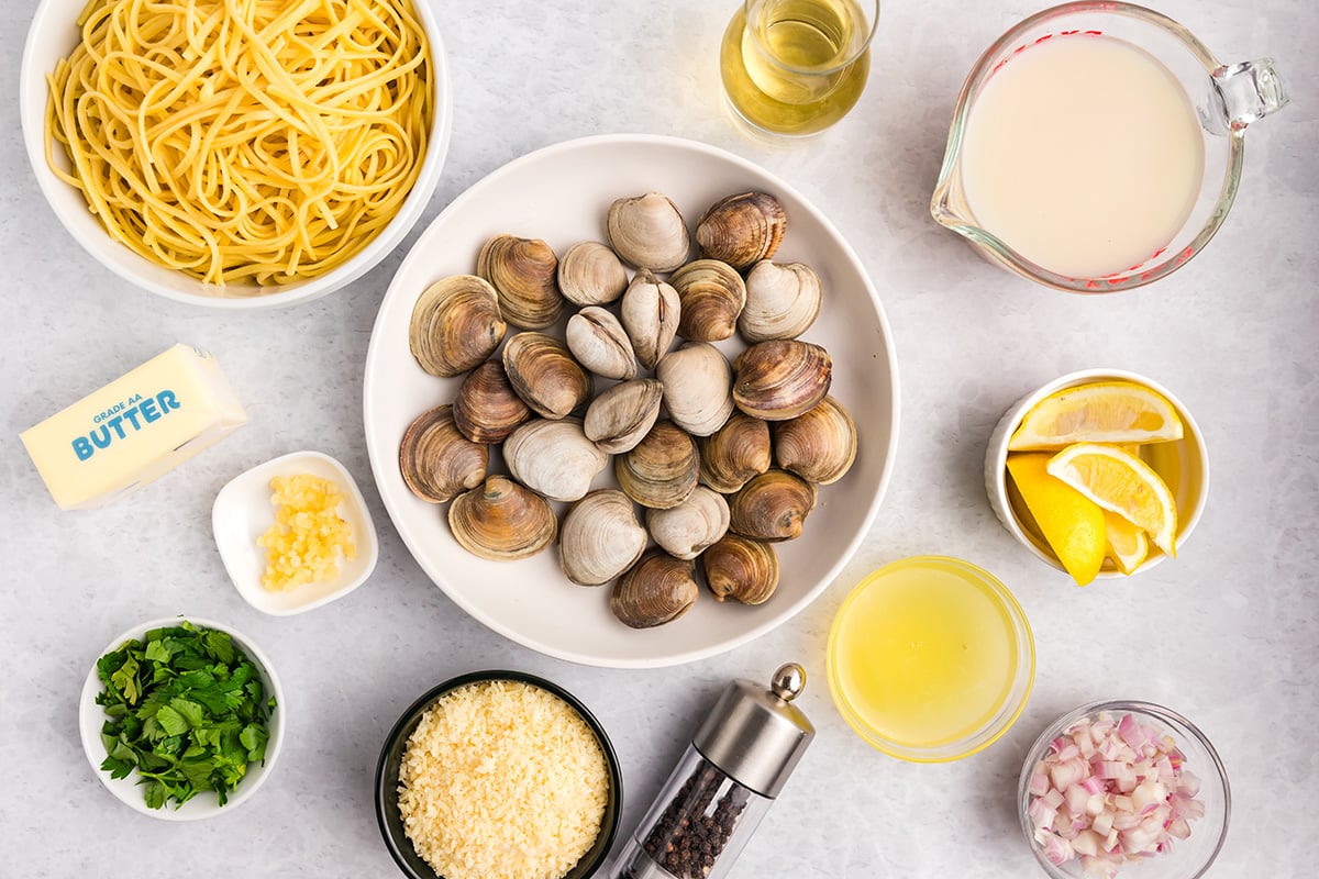 overhead shot of linguine with white clam sauce ingredients