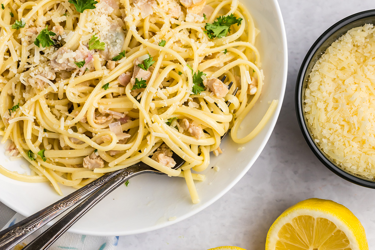 close up overhead shot of clam pasta twirled around fork