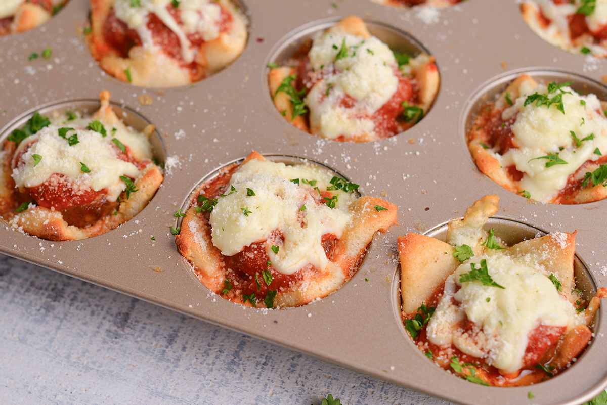 close up angled shot of tray of cheesy meatball bombs