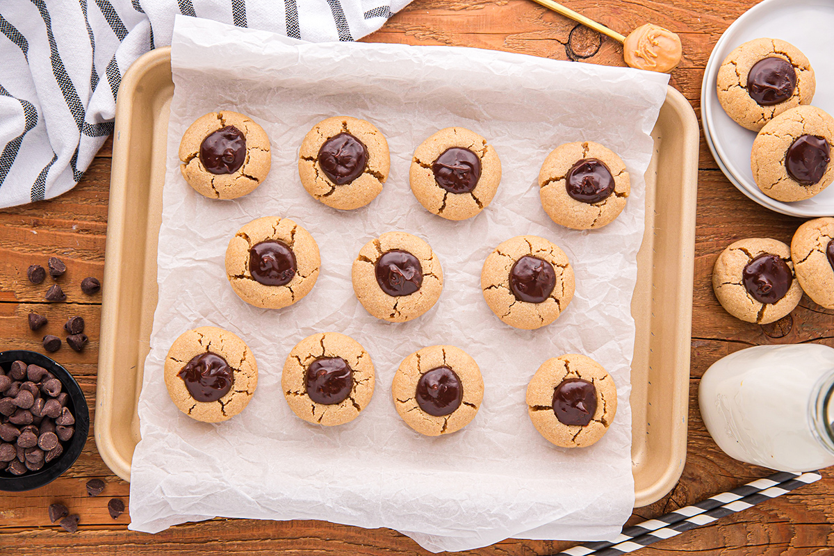 overhead shot of tray of peanut butter thumbprint cookies