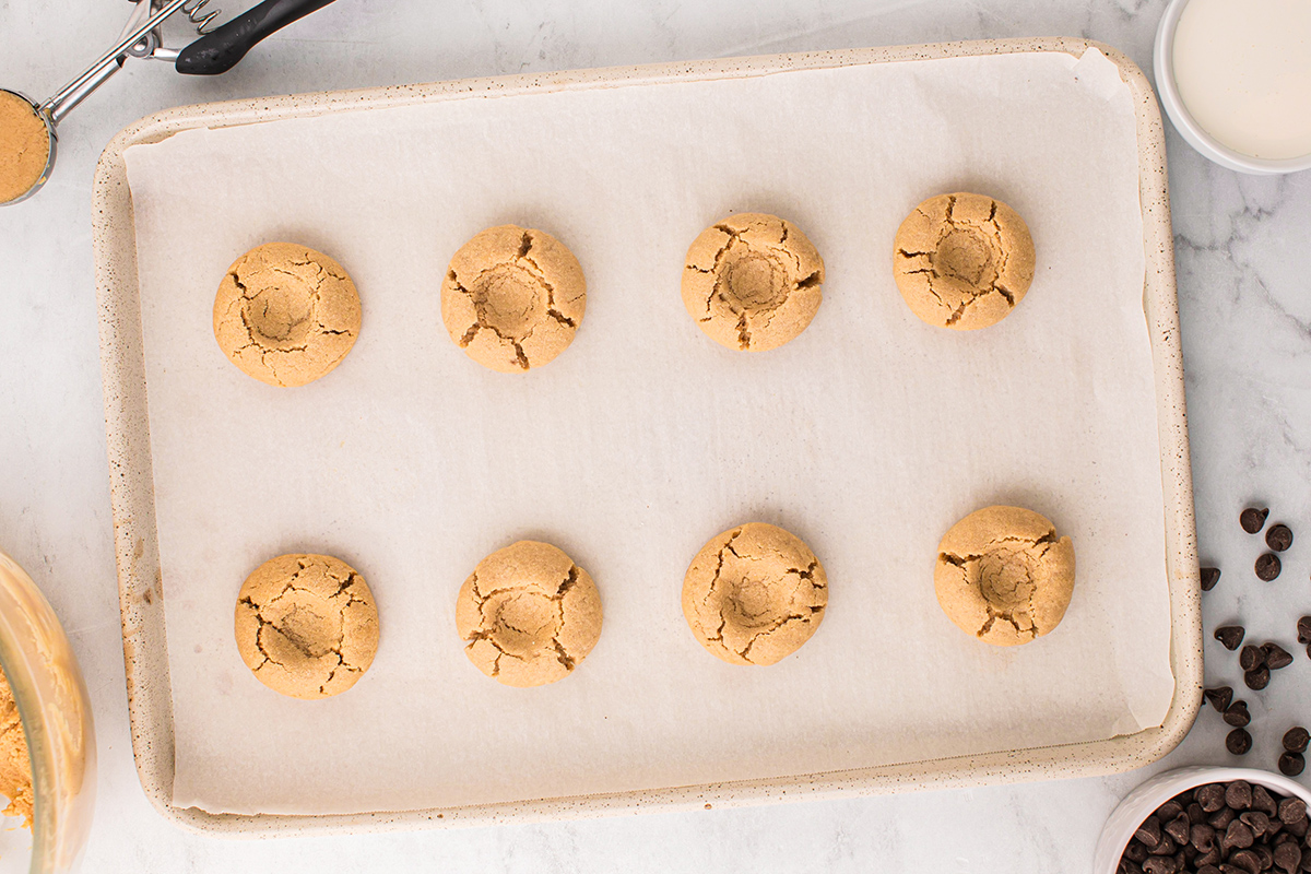 overhead shot of wells in peanut butter cookies