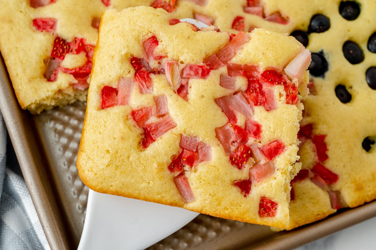 close up of strawberry sheet pan pancake on spatula