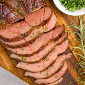 overhead shot of sliced sous vide chuck roast on cutting board