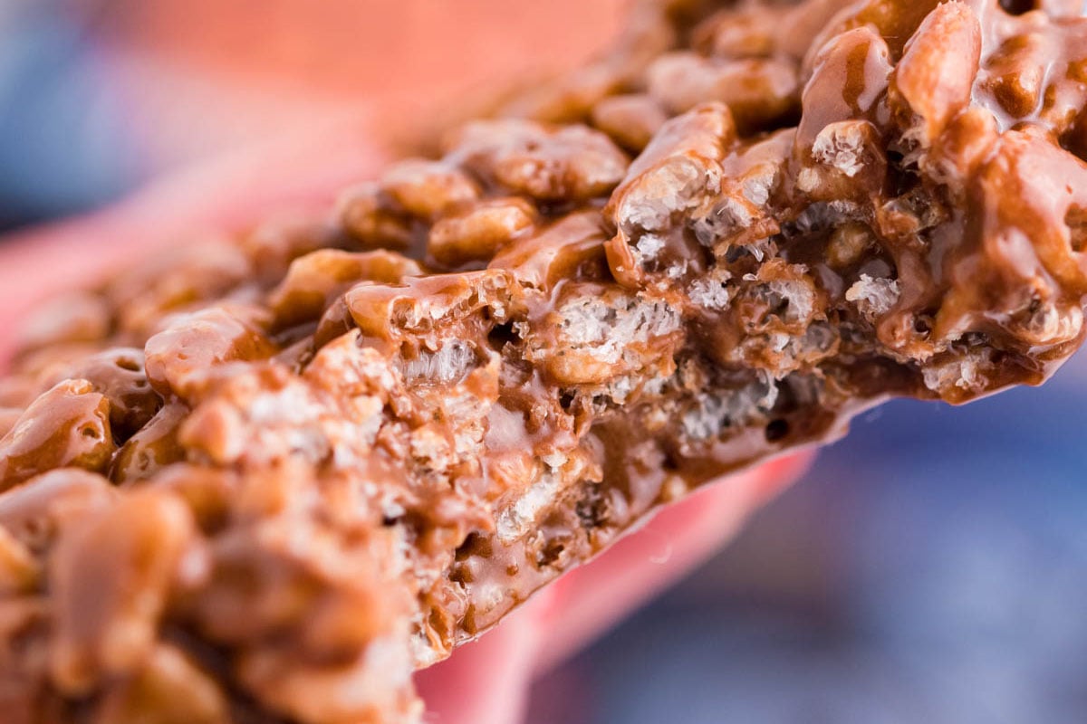 hand holding close up bite shot of a star crunch cookie