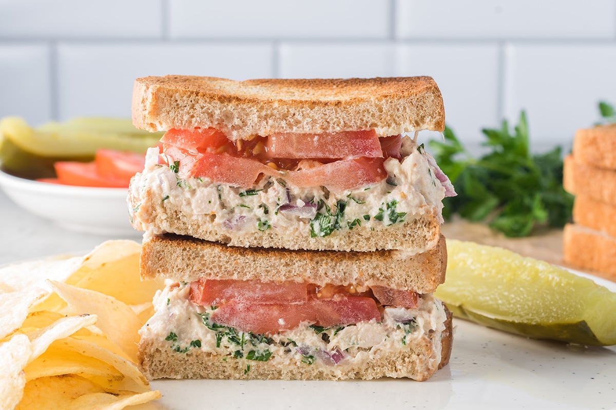 straight on shot of stack of tuna salad sandwich halves