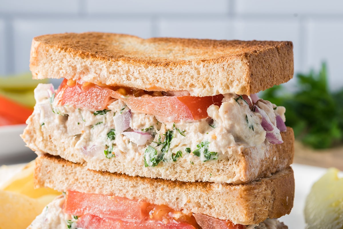 close up straight on shot of stack of tuna salad sandwich halves